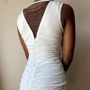 BCX dress with a back cutout and beaded detailing.